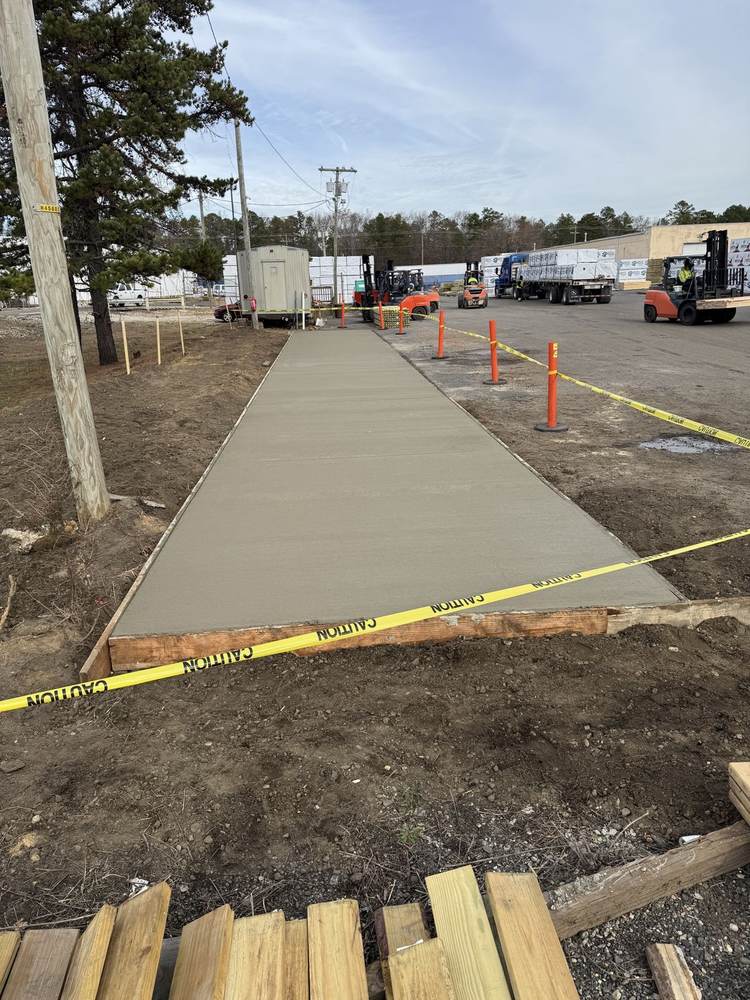 Commercial concrete walkway poured at an industrial lumber yard by South Jersey Construction Enterprise