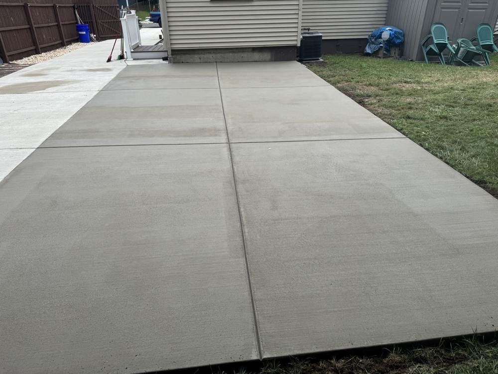 New concrete driveway with a clean broom finish by South Jersey Construction Enterprise
