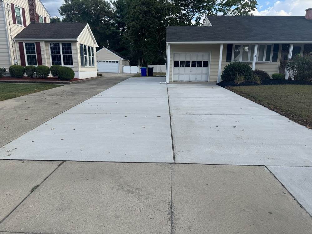Wide cured concrete driveway by South Jersey Construction Enterprise