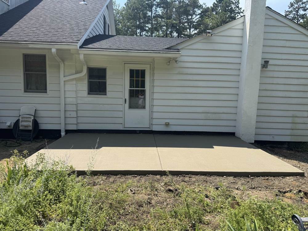 New concrete patio poured outside a home's back door by South Jersey Construction Enterprise