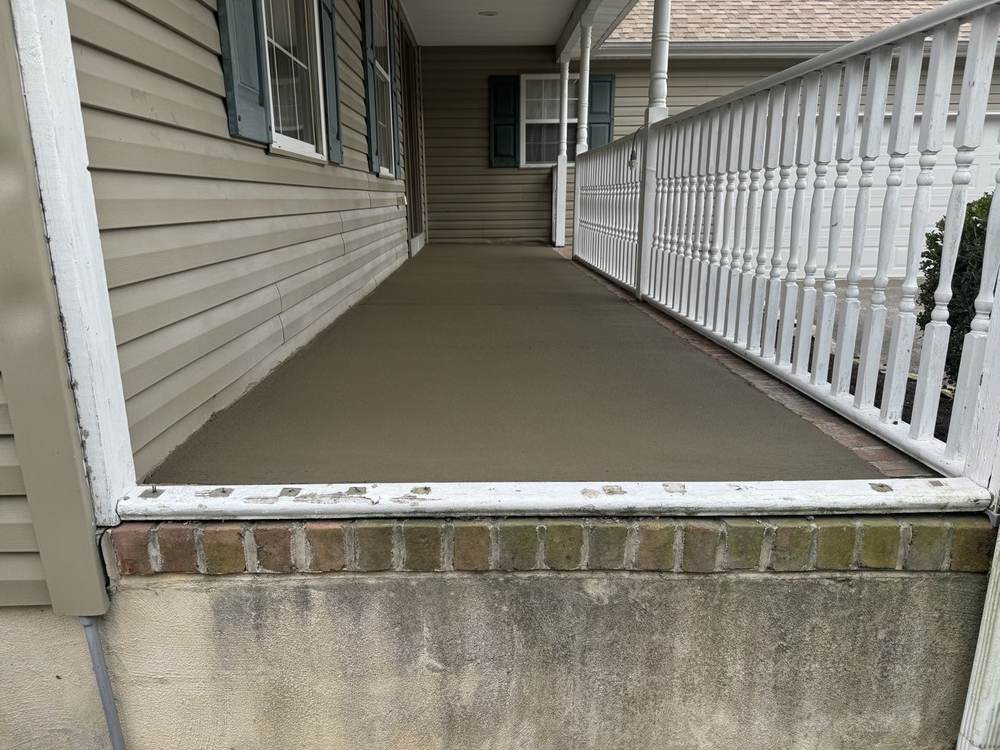 Smooth concrete porch floor finished by South Jersey Construction Enterprise
