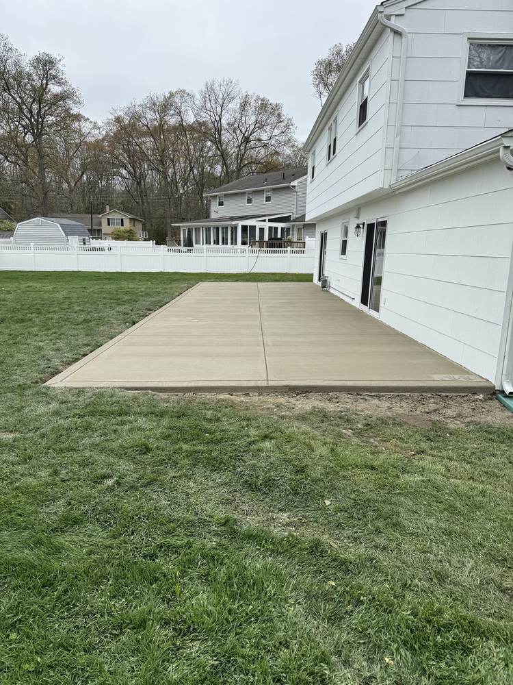 New concrete porch stoop with step installed by South Jersey Construction Enterprise