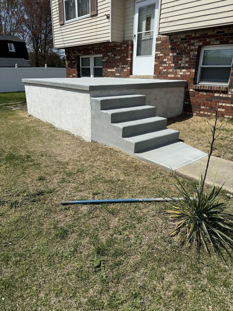 New concrete porch with steps installed by South Jersey Construction Enterprise