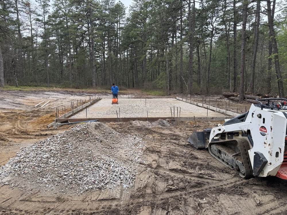 Site prep: gravel base compaction with a track loader for a South Jersey Construction Enterprise concrete project