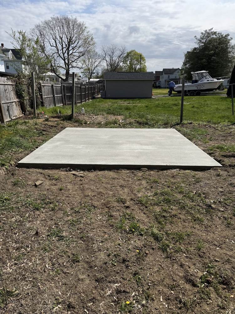 Concrete slab pad poured in a backyard by South Jersey Construction Enterprise