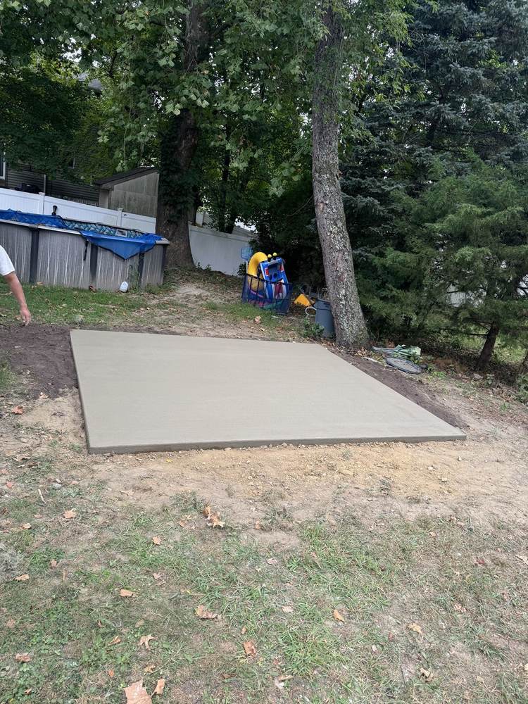 Concrete slab pad near an above-ground pool area by South Jersey Construction Enterprise